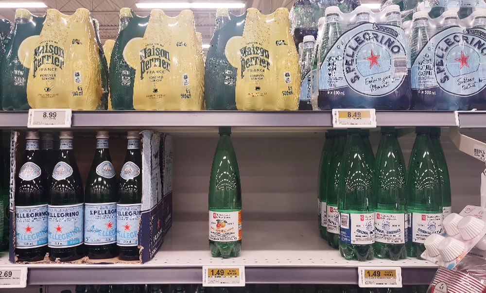  superstore stocking it's own water bottle next to the competition